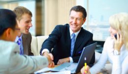 Business people shaking hands, finishing up a meeting